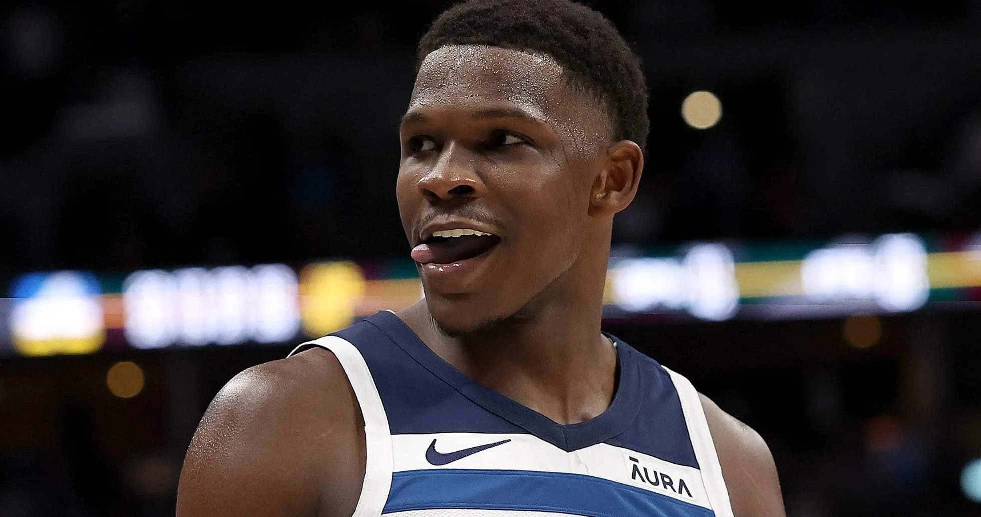 Basketball player smiling during game action