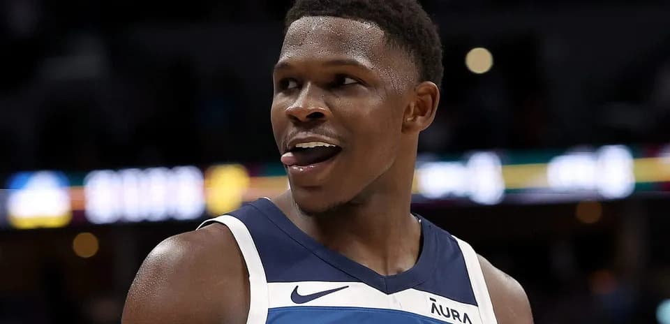 Basketball player smiling during game action