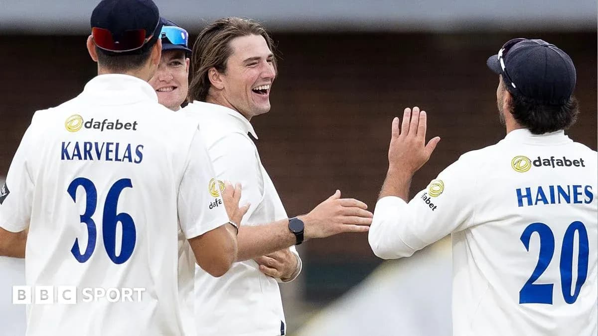 Cricket players celebrating a wicket together