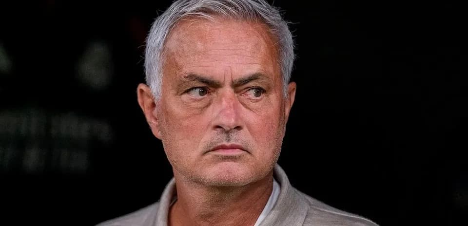 Manager observing from the sidelines during match