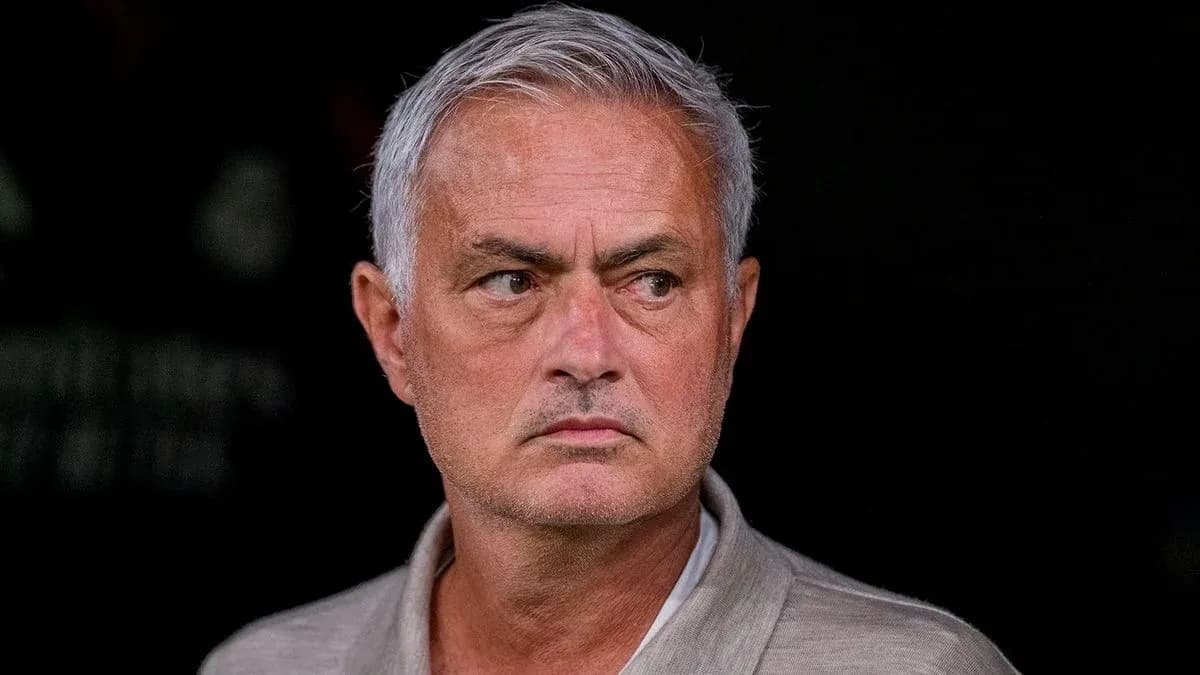 Manager observing from the sidelines during match