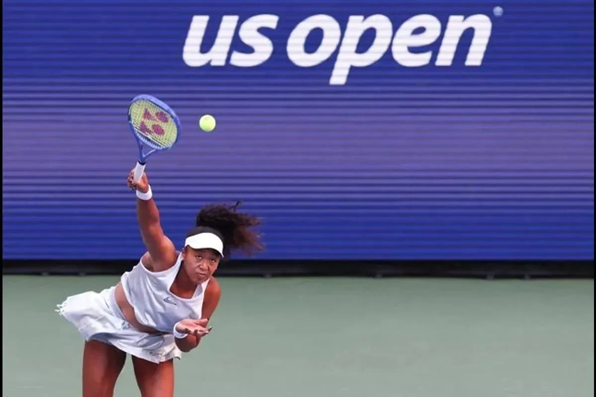Player serving during US Open tennis match