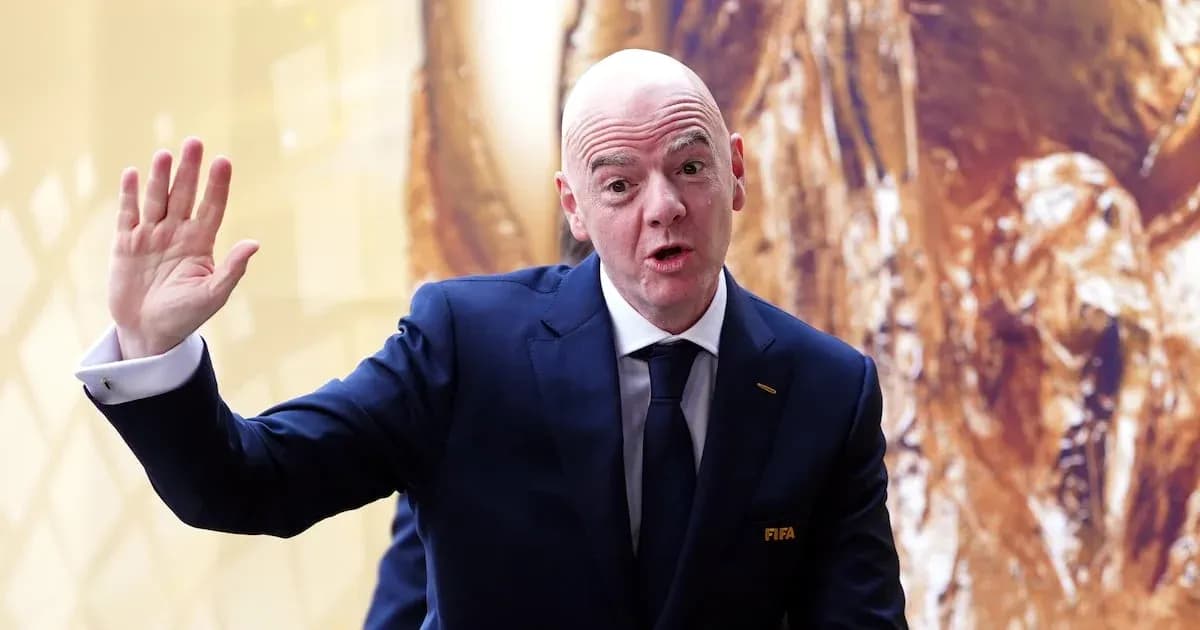 FIFA official speaking with raised hand at event