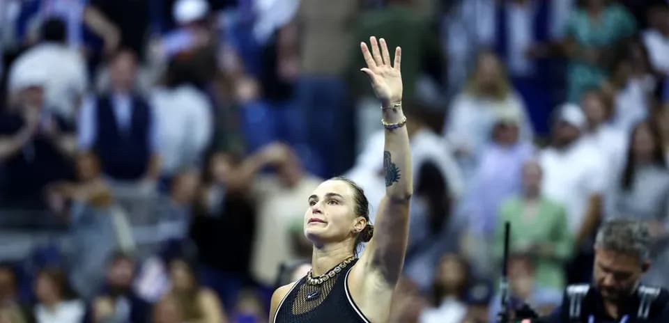 Player waving to crowd after match victory