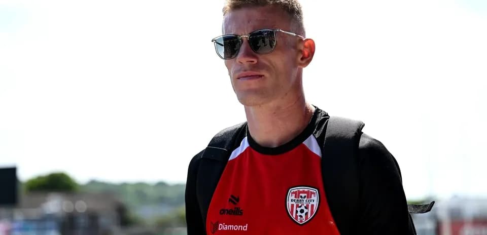 Player wearing sunglasses in Derry City jersey