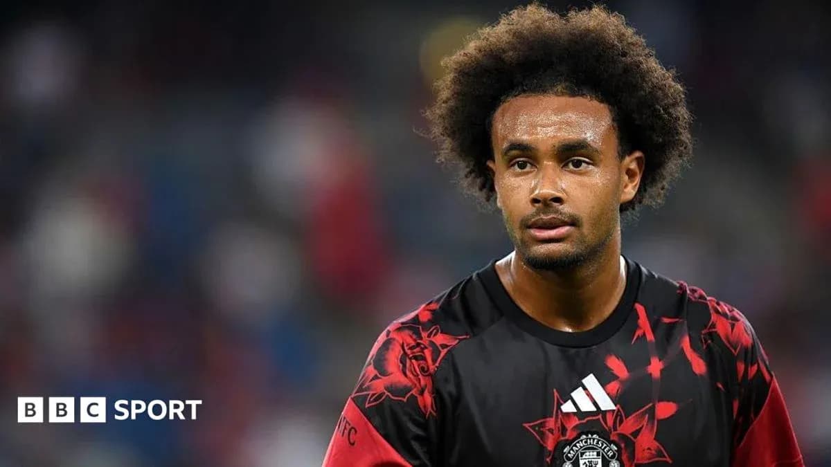 Player wearing red and black jersey during match