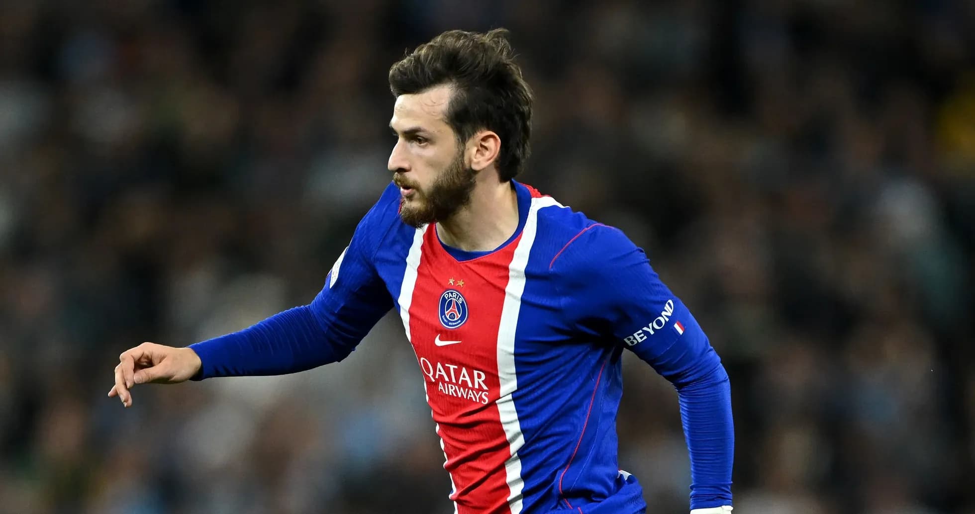 Player running with ball during PSG match