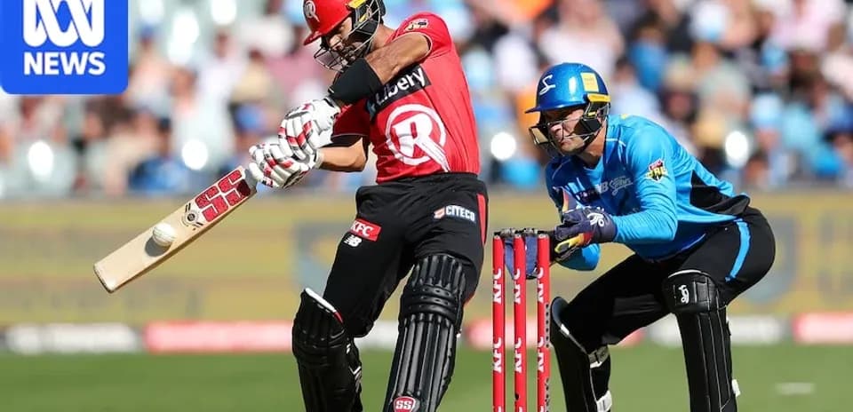 Batsman striking the ball with wicketkeeper behind