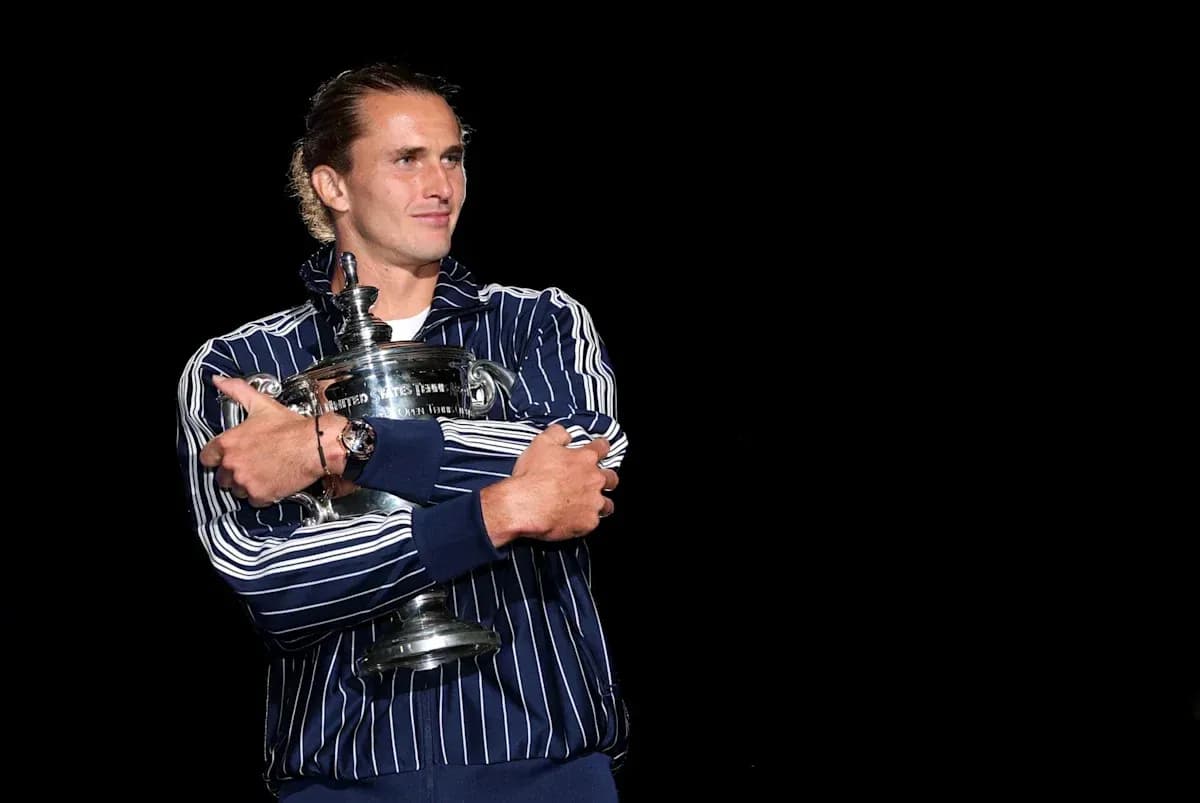 Player holding trophy in dark background