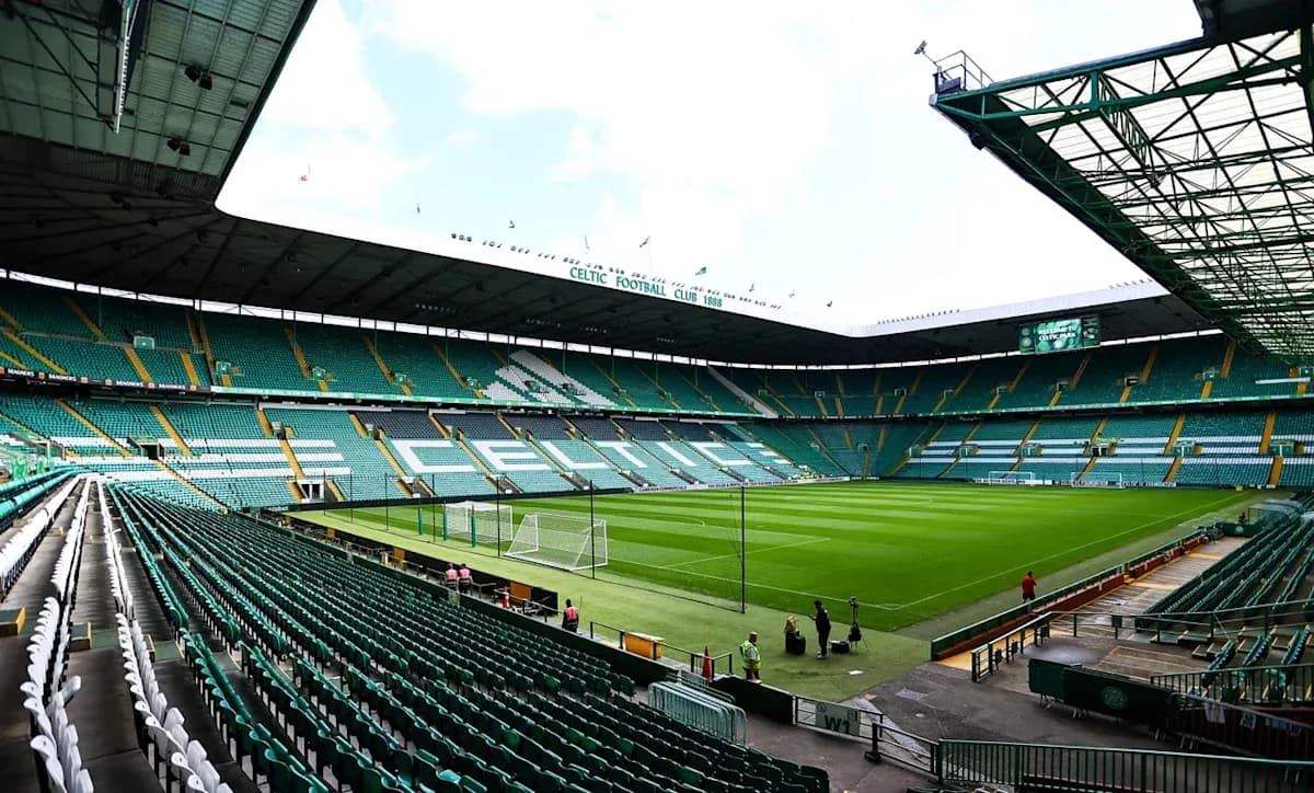 Empty Celtic Park stadium with green seating and pitch