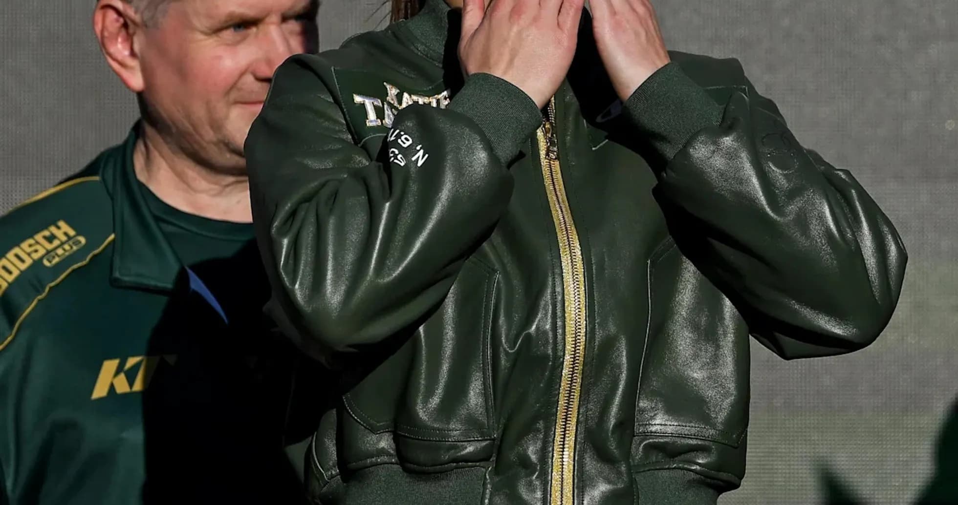 Female boxer blowing kisses at public event