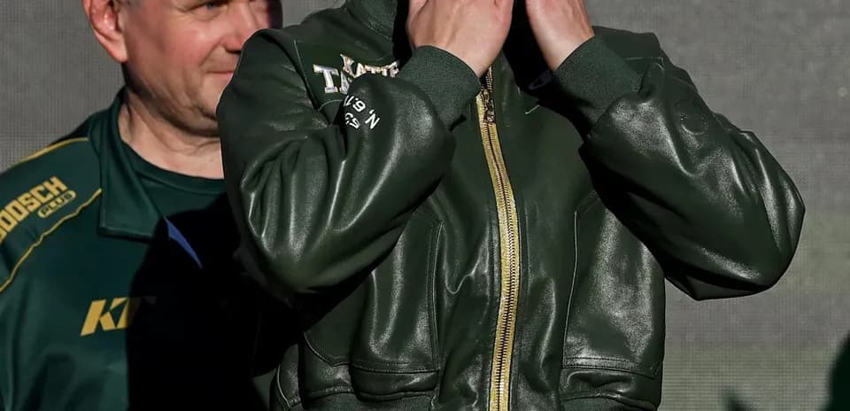 Female boxer blowing kisses at public event