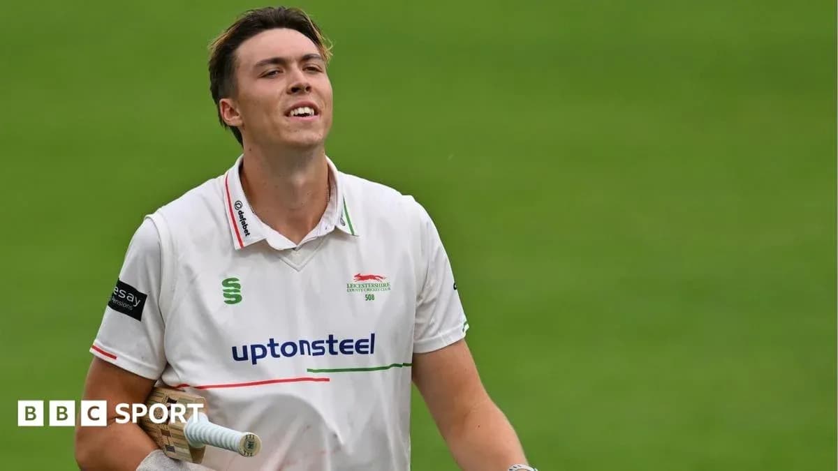 Cricketer walking off the field after innings