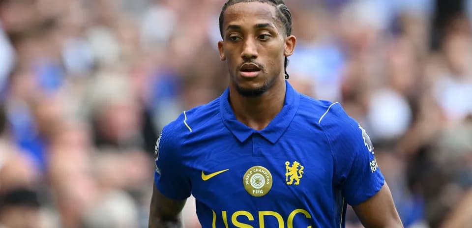 Player wearing Chelsea jersey on the pitch