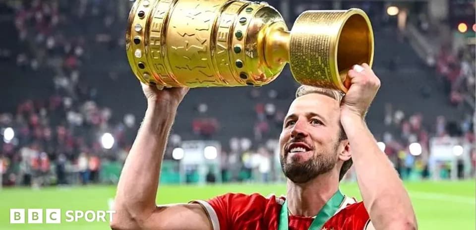 Player lifting trophy in celebration after match