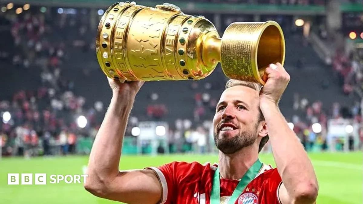 Player lifting trophy in celebration after match