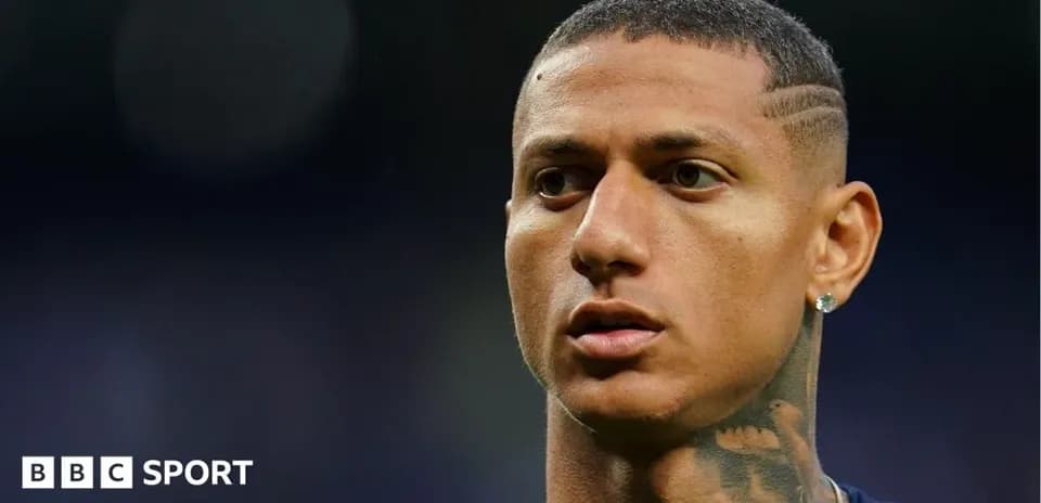 Player with short hair and tattoos on neck