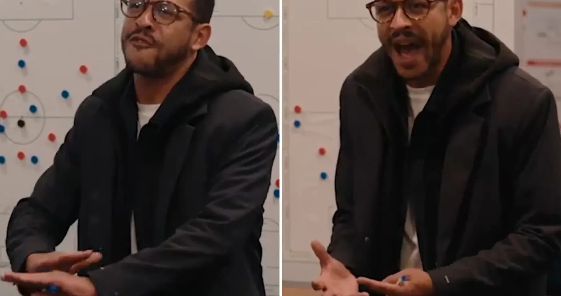 Coach discussing strategy in front of a whiteboard