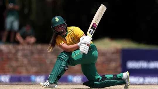 Batter playing a shot during cricket match