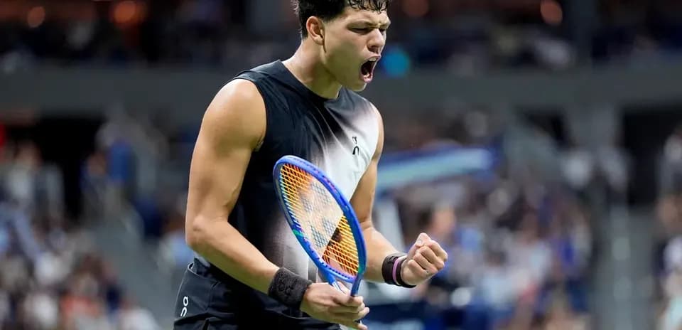 Tennis player celebrating victory during match
