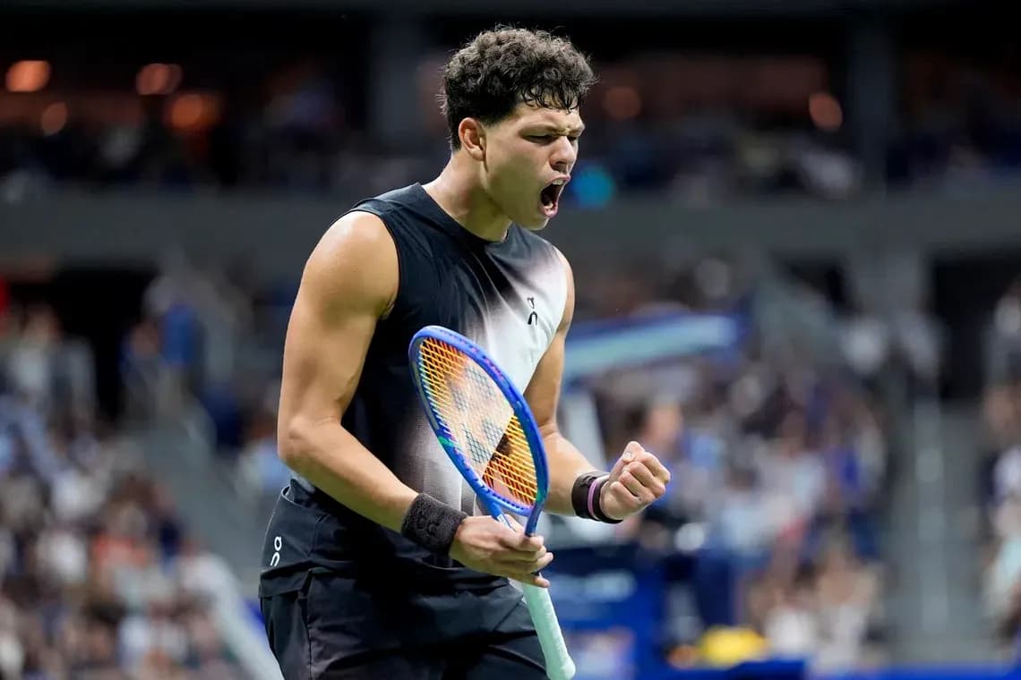 Tennis player celebrating victory during match