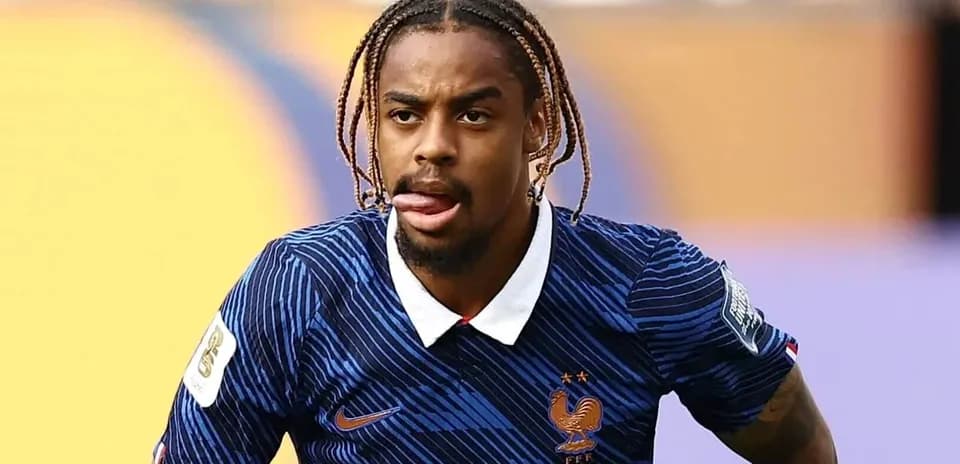 Player in France kit during football match action