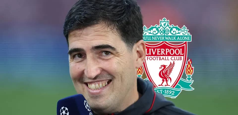 Man smiling with Liverpool FC logo in background