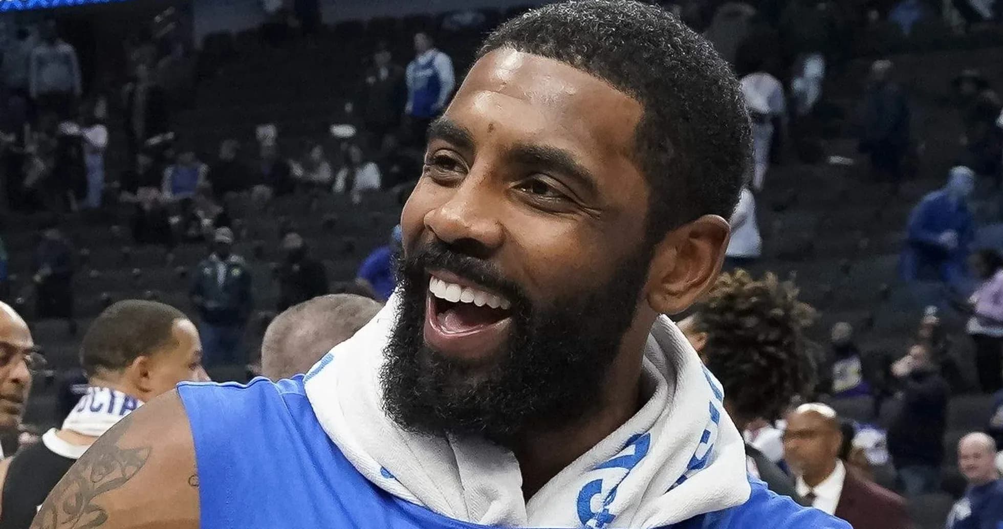 Player celebrating after a game in blue jersey