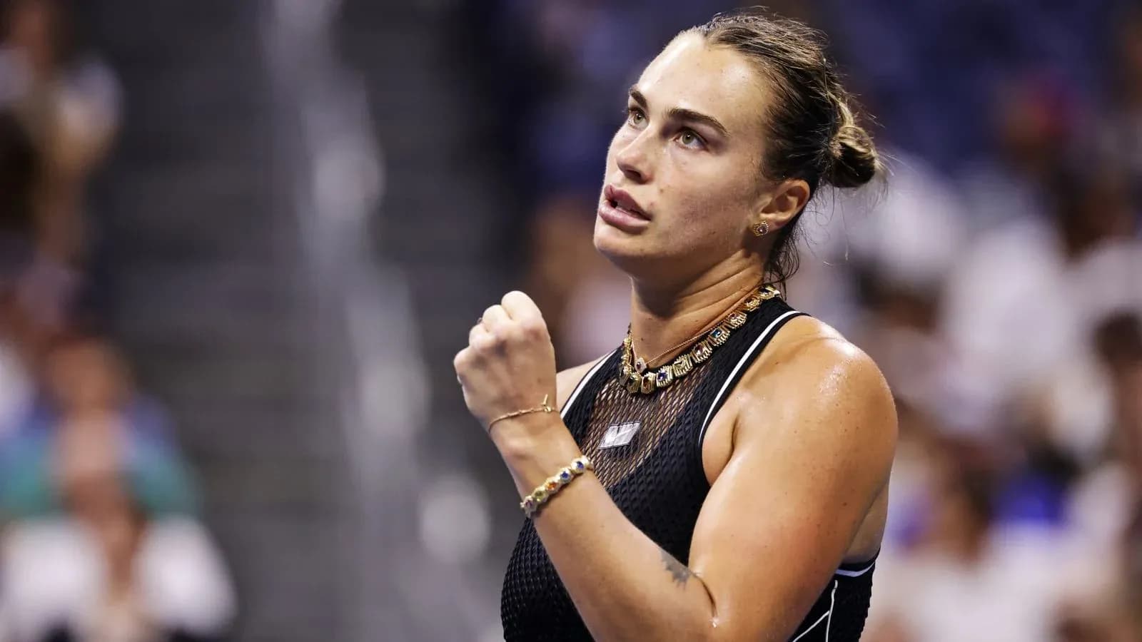 Tennis player celebrating during a match