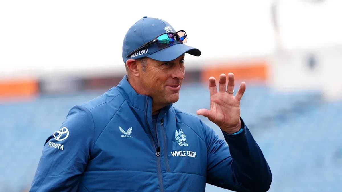Cricket coach gesturing during training session