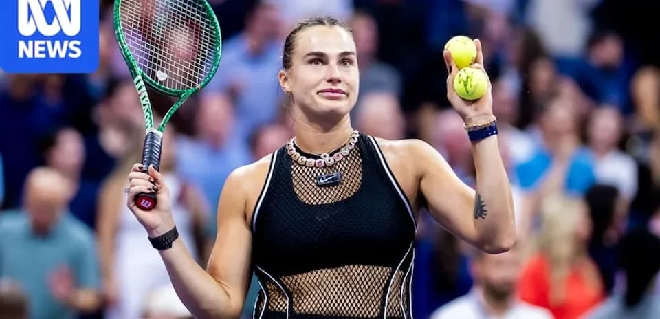 Player holding tennis balls and racket on court