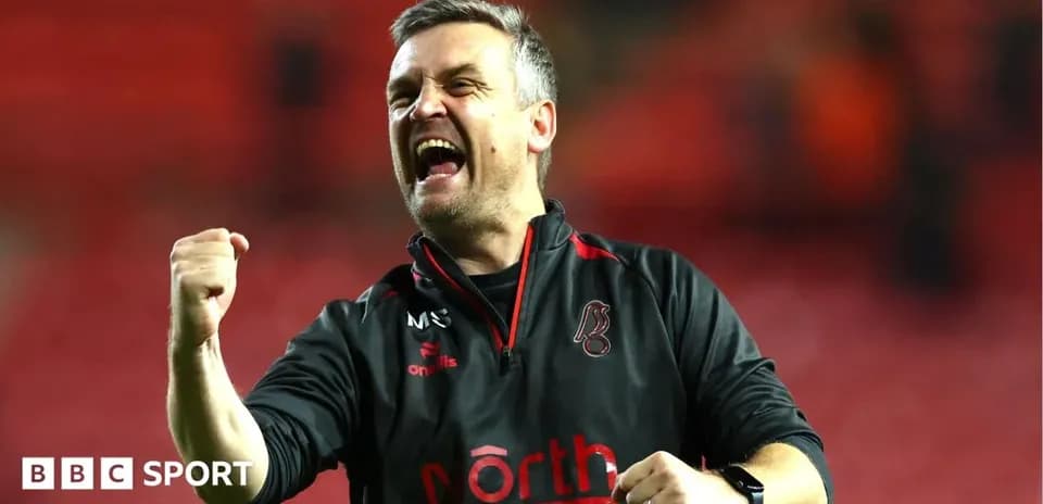 Coach celebrating enthusiastically after a match