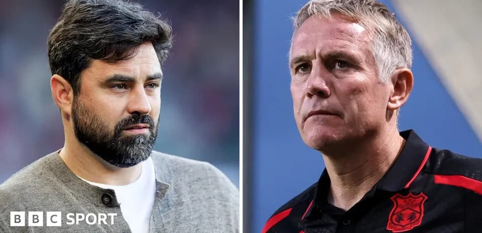 Two football managers during a pre-match discussion