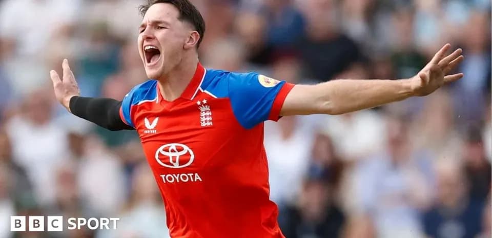 Cricketer celebrating a wicket in team uniform