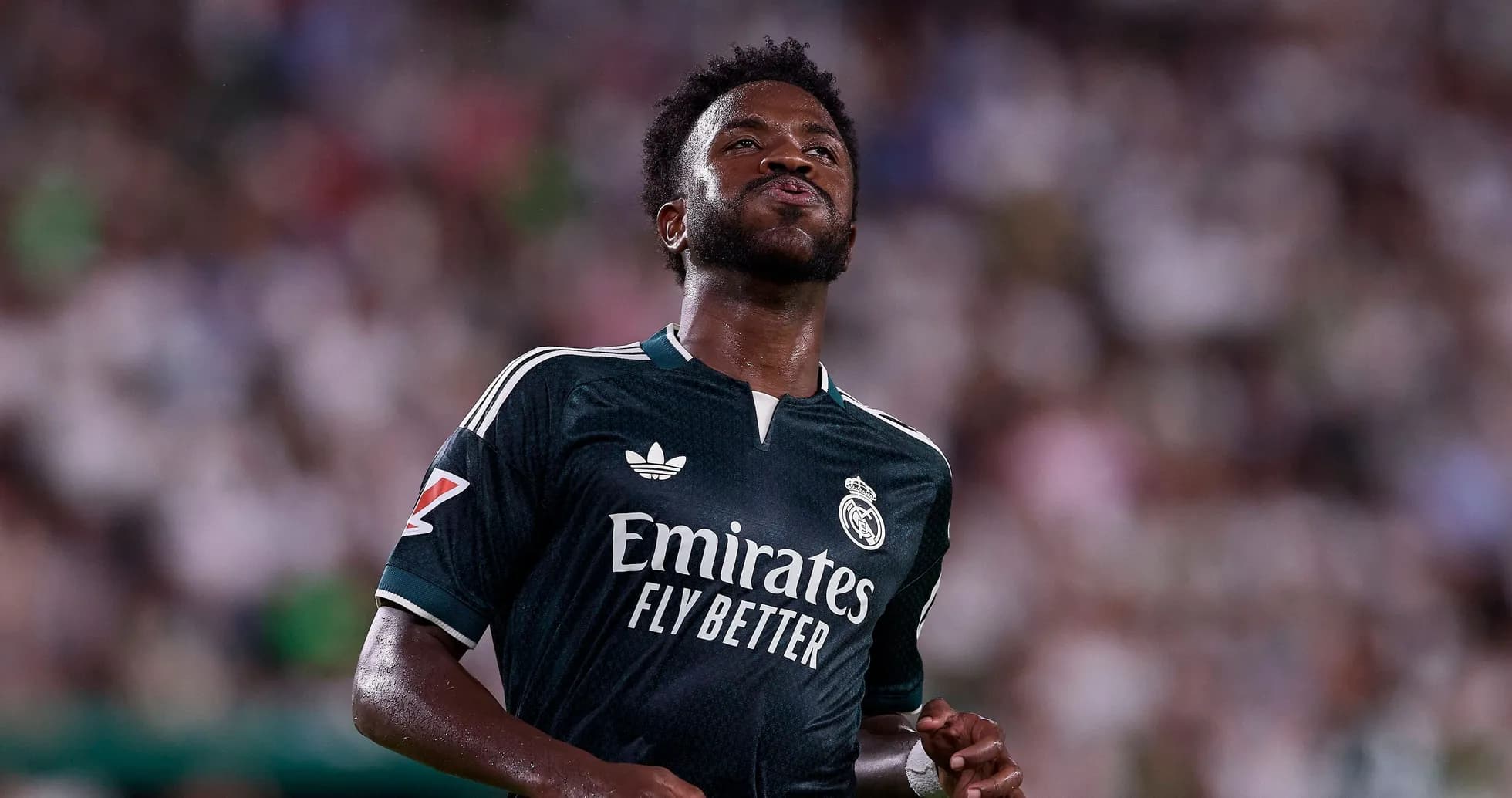 Player in Real Madrid kit during match action