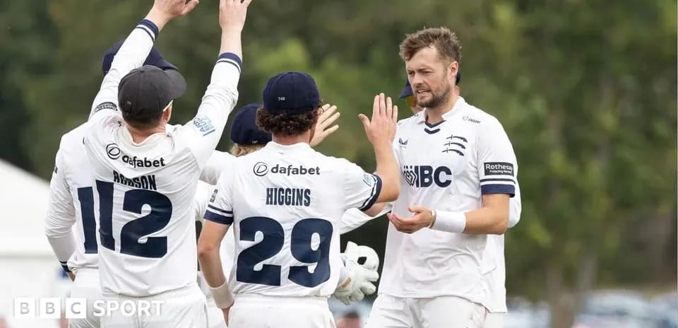 Cricket team celebrating a wicket on the field