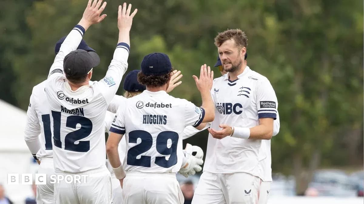Cricket team celebrating a wicket on the field