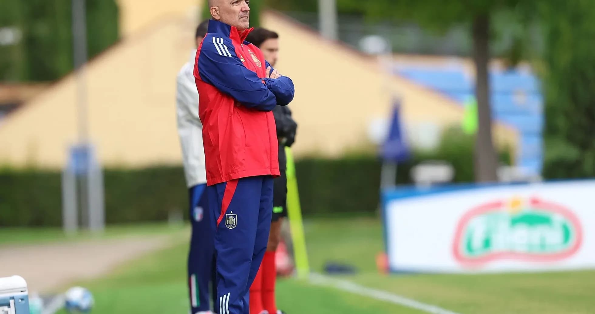 Coach observing from the sidelines during training session