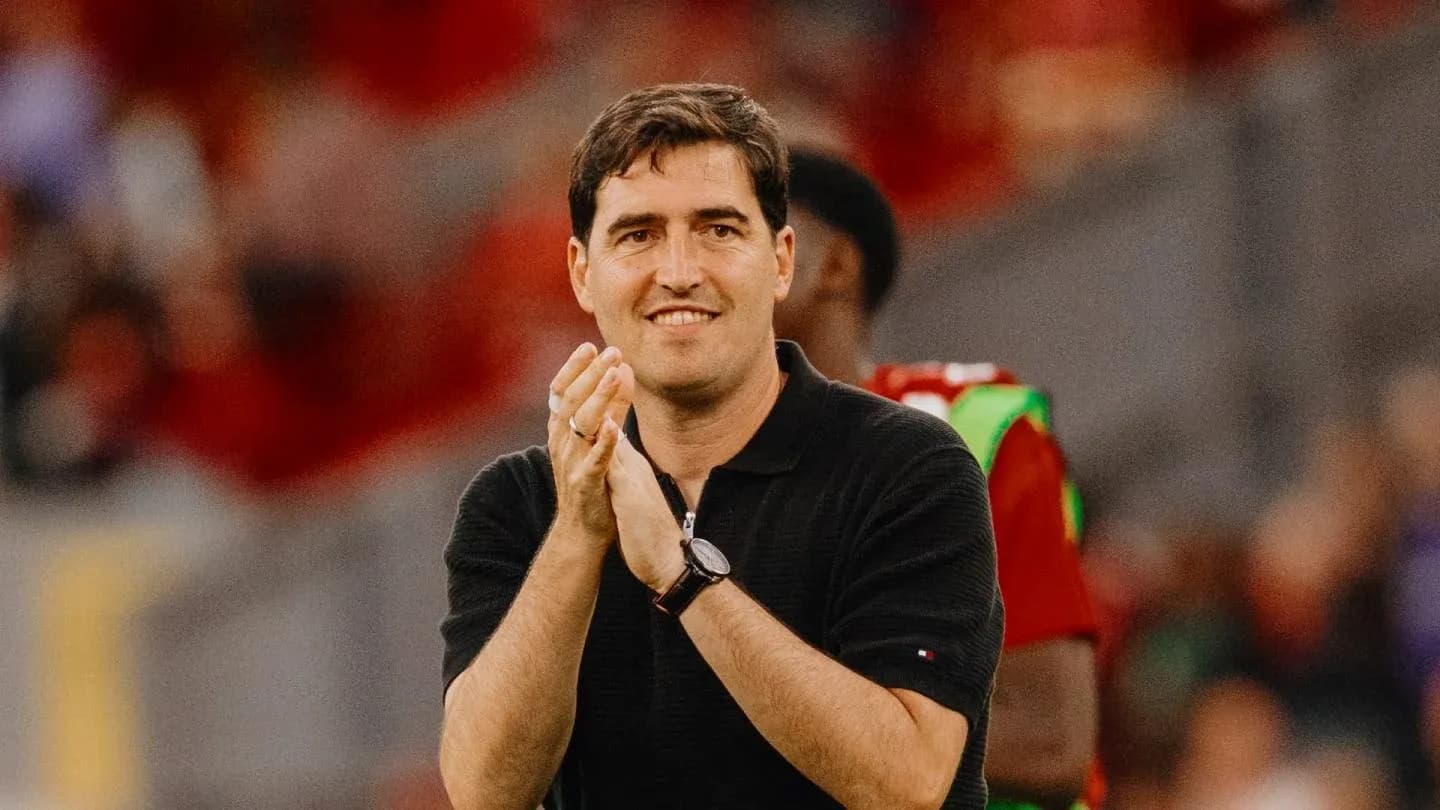 Coach applauding during a match on the sidelines Coach applauding during a match on the sidelines