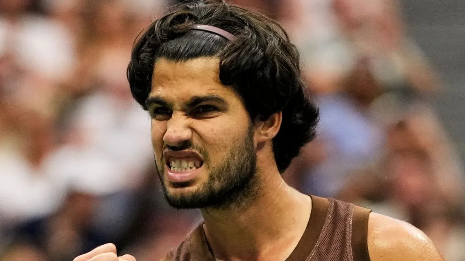 Tennis player celebrating after winning a point Tennis player celebrating after winning a point