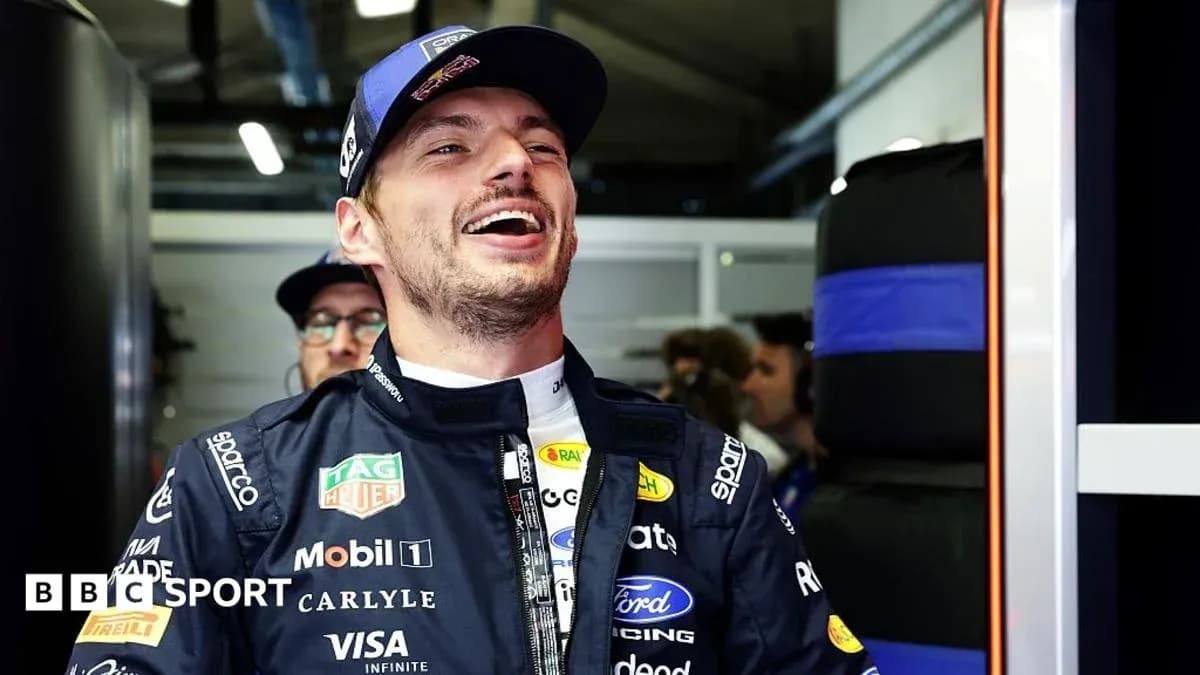 Driver smiling in the garage before race Driver smiling in the garage before race
