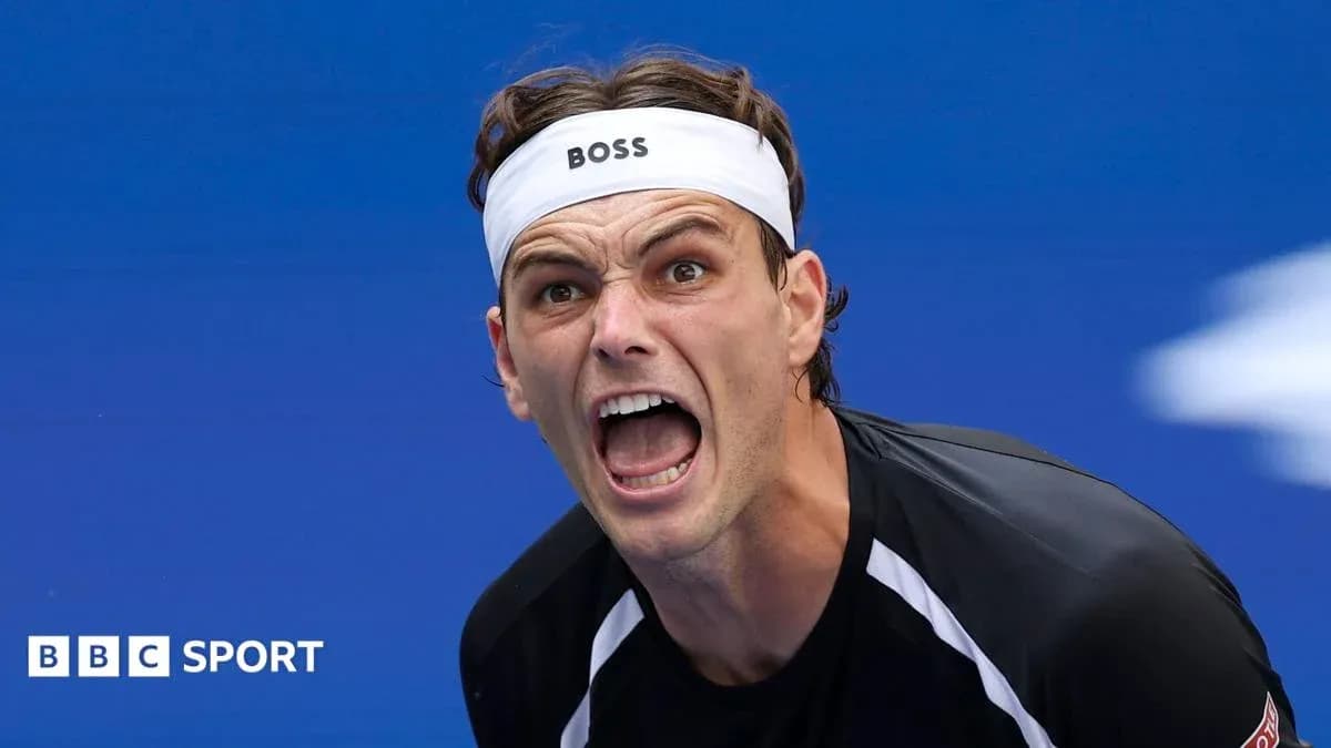 Tennis player celebrating with intense expression Tennis player celebrating with intense expression