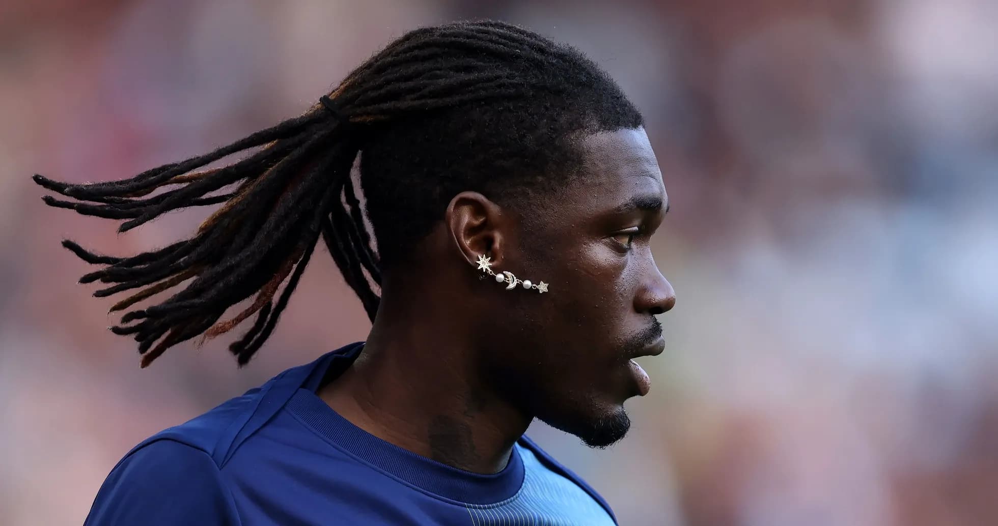 Player with dreadlocks during warm-up session Player with dreadlocks during warm-up session
