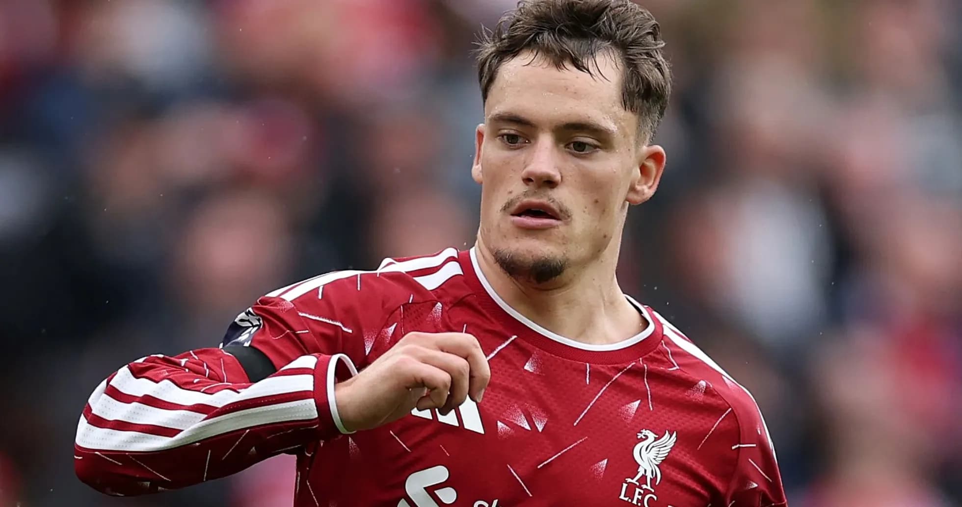 Player in Liverpool kit gesturing during match Player in Liverpool kit gesturing during match