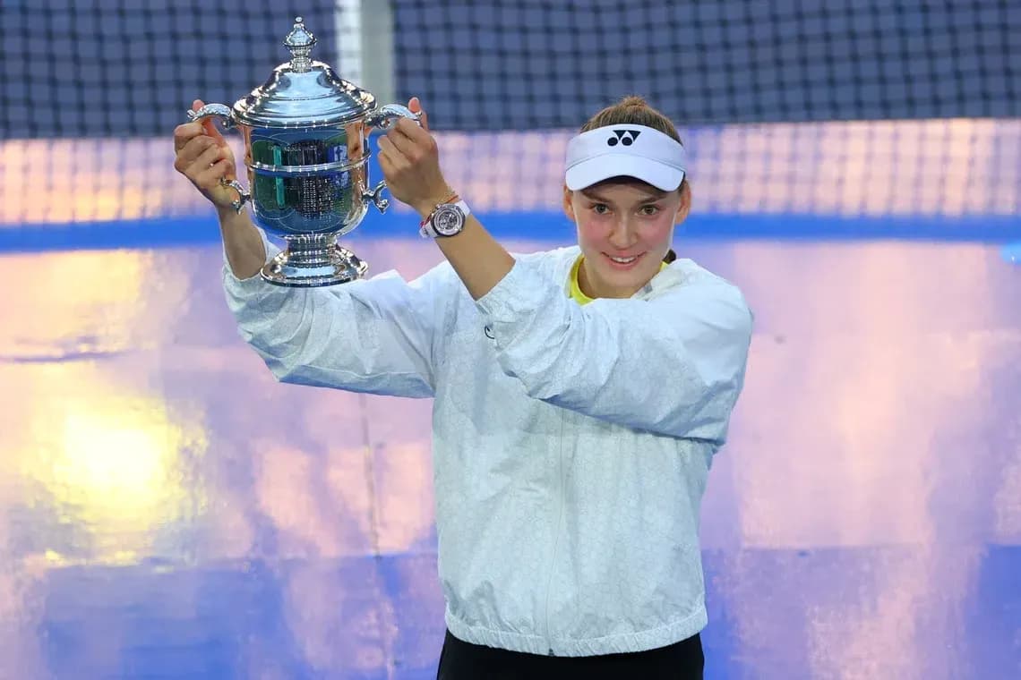 Player celebrating with trophy after match victory Player celebrating with trophy after match victory