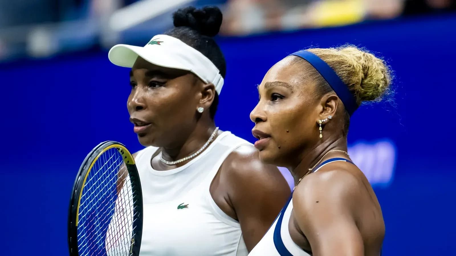 Venus and Serena Williams during tennis match Venus and Serena Williams during tennis match