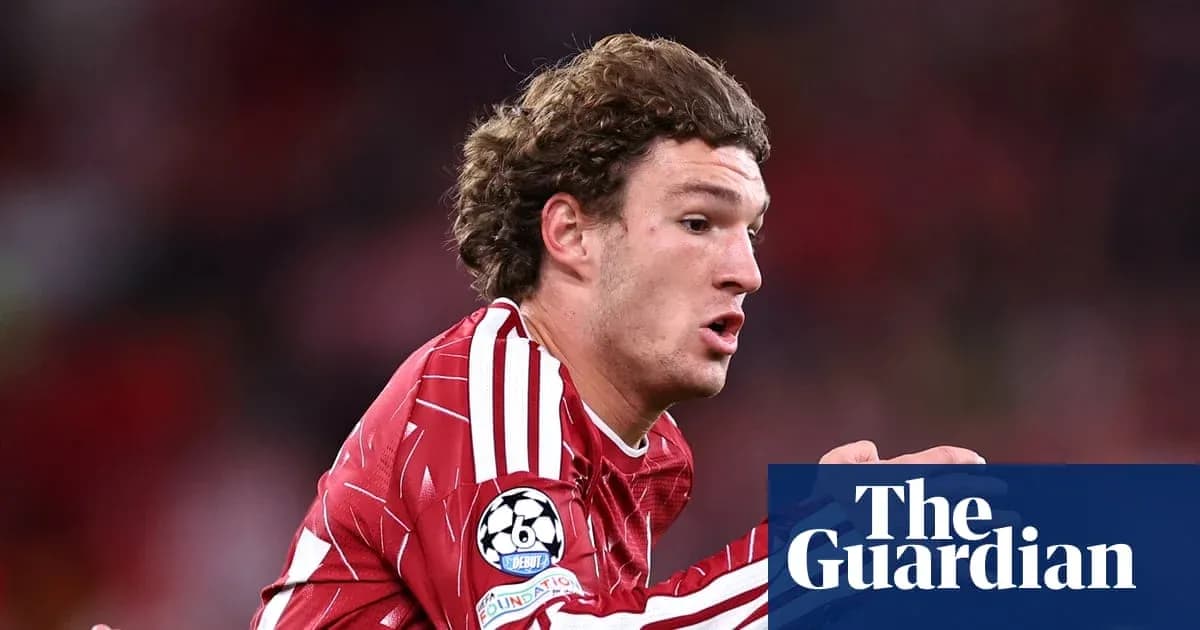 Player running during a Champions League match Player running during a Champions League match