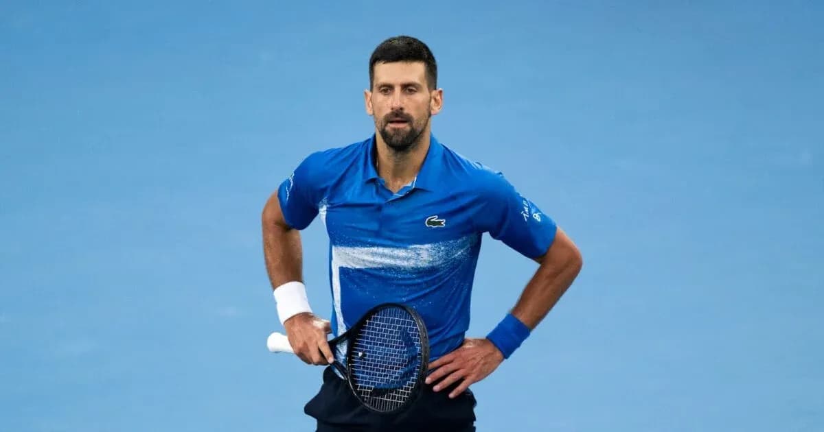 Tennis player in blue shirt on court Tennis player in blue shirt on court