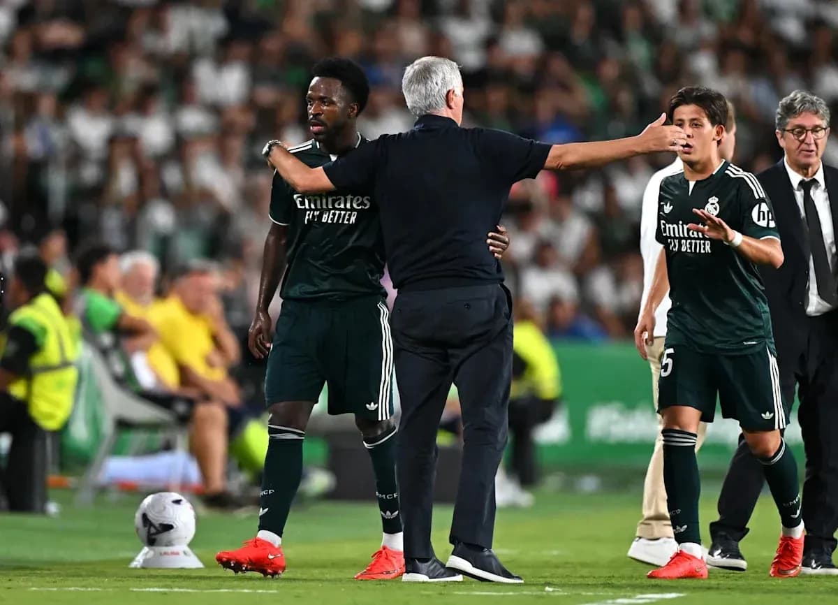 Coach instructing players during a match substitution Coach instructing players during a match substitution