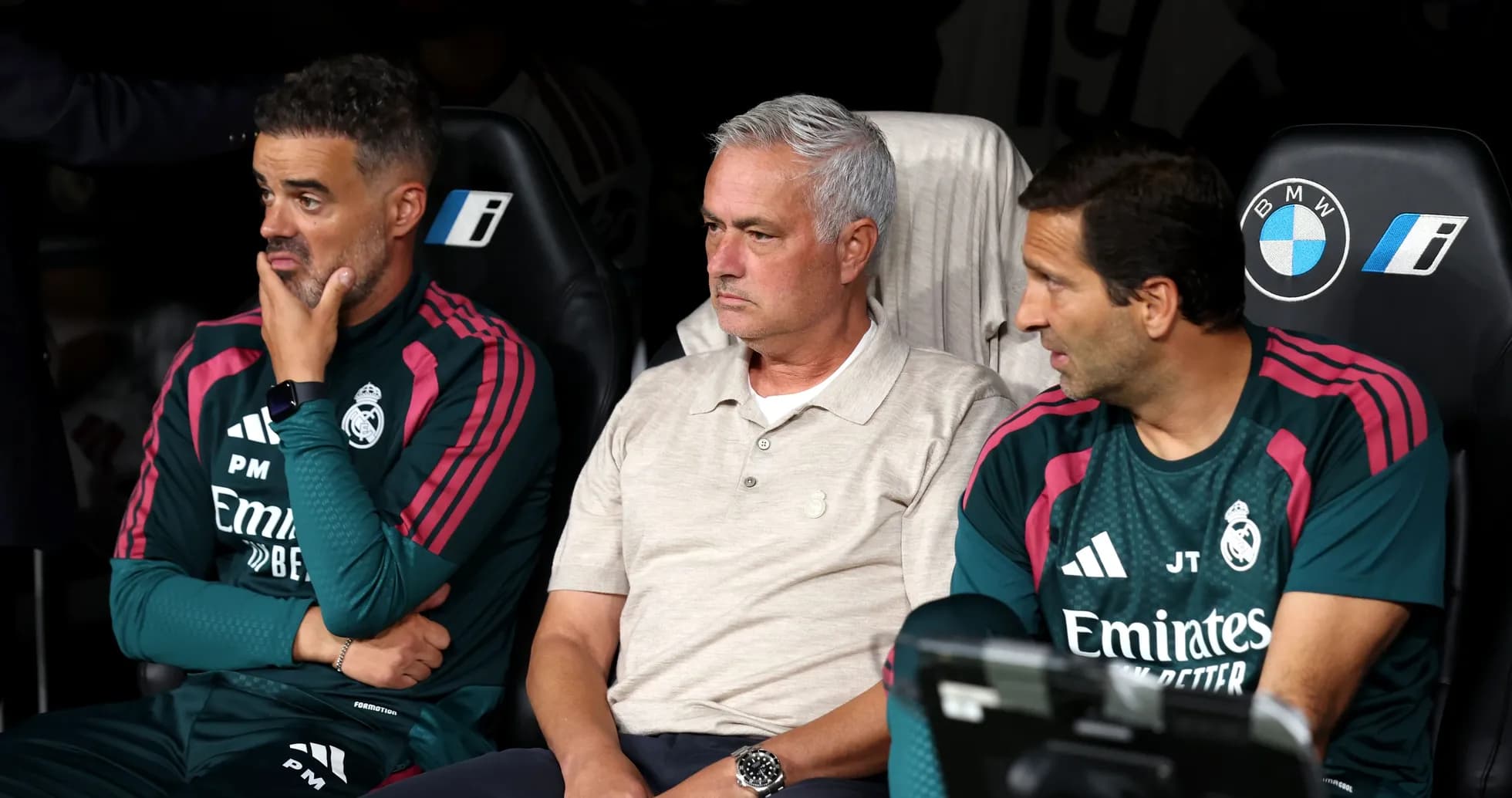 Coaching staff seated on bench during match Coaching staff seated on bench during match